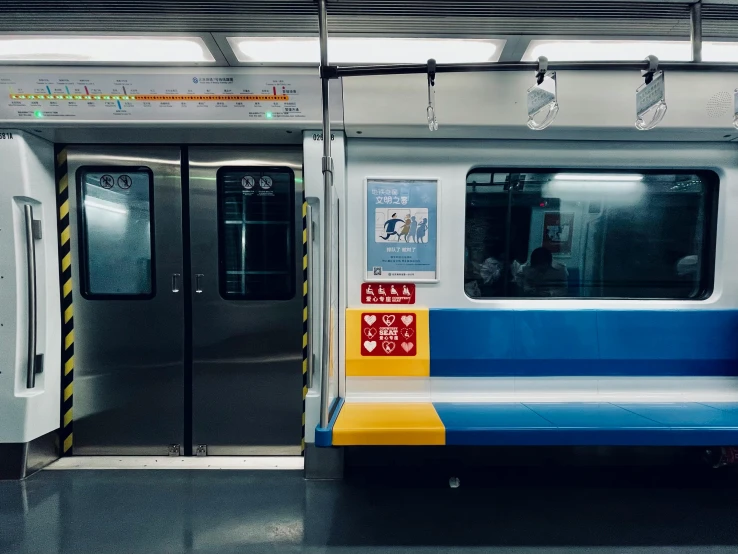 a blue and white train with its doors open, by Jang Seung-eop, unsplash contest winner, subway, beijing, photo on iphone, 15081959 21121991 01012000 4k