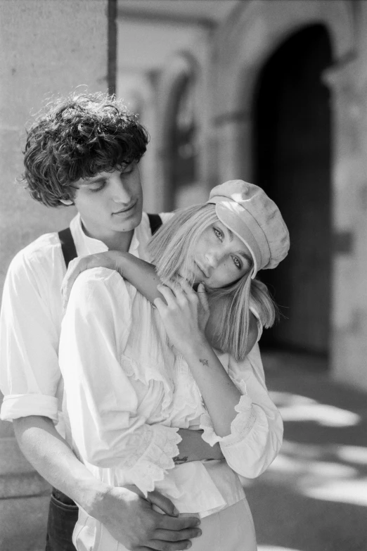 a black and white photo of a man and a woman, inspired by Jean Tabaud, renaissance, riccardo scamarcio, 1970s fashion, white clothes, 15081959 21121991 01012000 4k