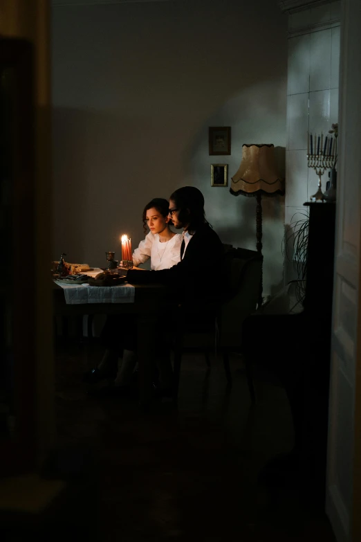 a couple of people that are sitting at a table, by Elsa Bleda, romanticism, candlelight, indoor scene, backlit, taken in the early 2020s