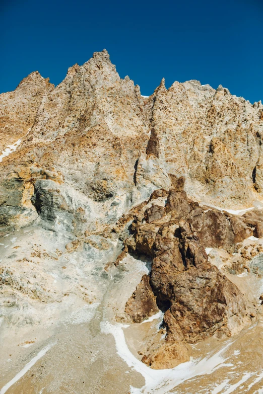 a man riding a snowboard down a snow covered slope, an album cover, unsplash, les nabis, chiseled formations, cyprus, 1999 photograph, panorama view