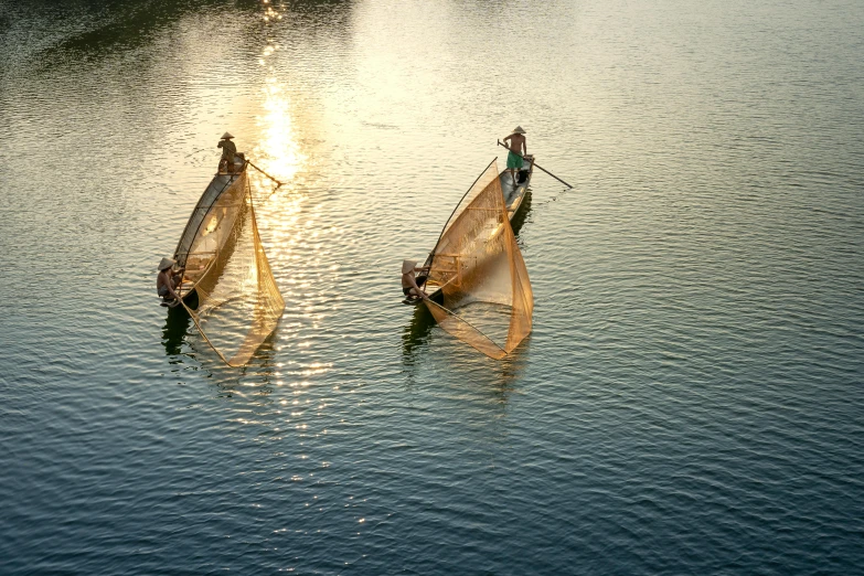 a couple of people that are in some water, pexels contest winner, hurufiyya, nets and boats, late afternoon sun, two male, nivanh chanthara