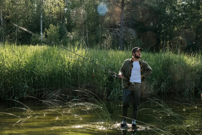 a man standing in the water with a fishing rod, instagram picture, tarmo juhola, fan favorite, nice afternoon lighting