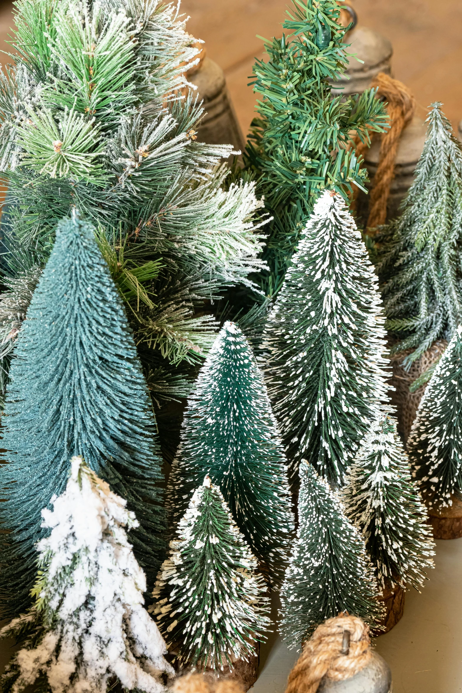 a group of small trees sitting on top of a table, inspired by Édouard Detaille, folk art, frosted, evergreen, up close, various styles