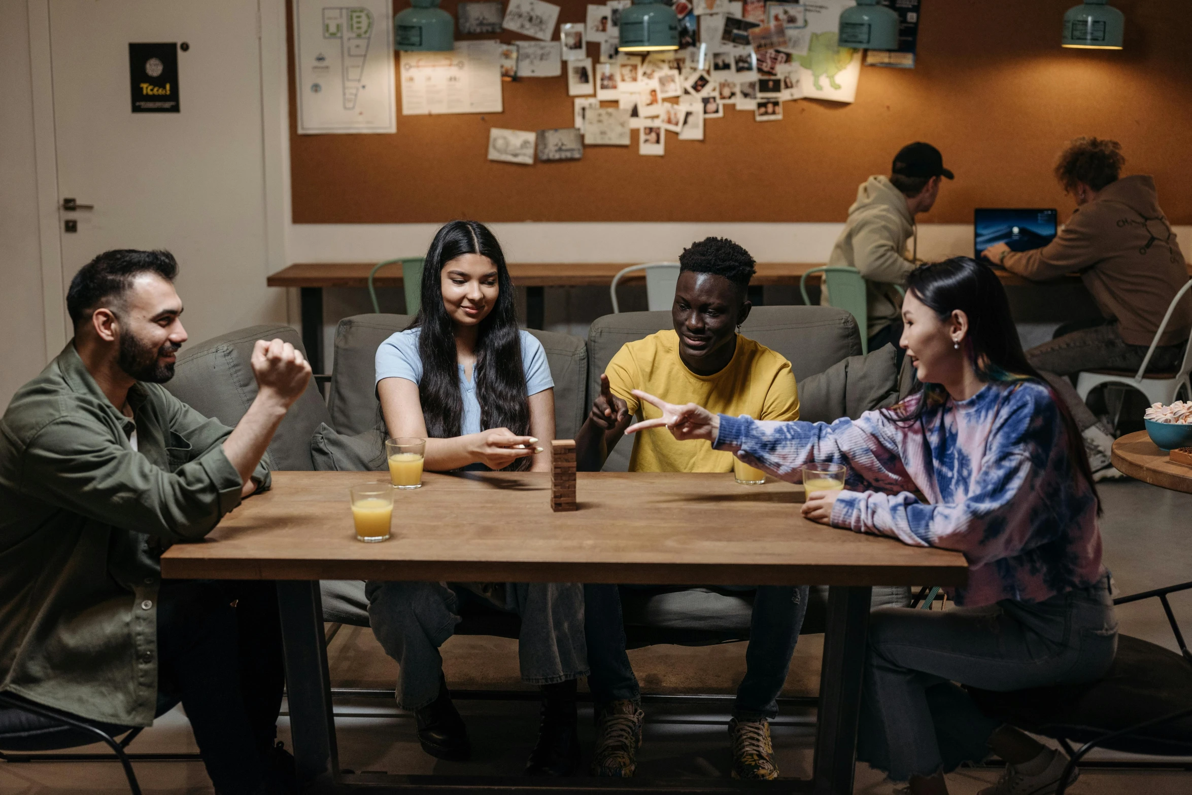 a group of people sitting around a wooden table, pexels contest winner, games, aussie baristas, avatar image, college