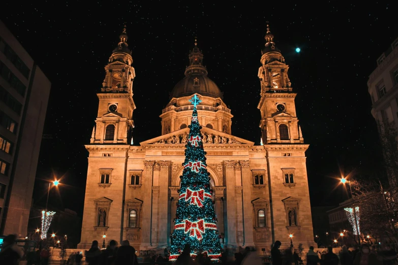 a large building with a christmas tree in front of it, profile image, tourist destination, cathedral, avatar image