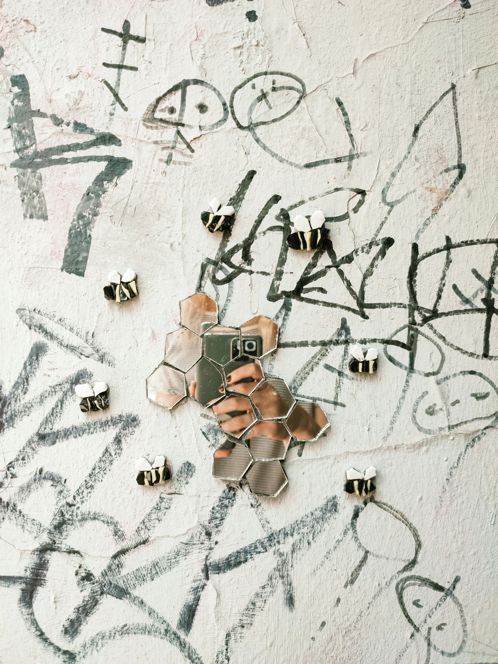 a person taking a picture of graffiti on a wall, a jigsaw puzzle, by Emma Andijewska, 3d bee made of metal, flatlay, pins, trending on vsco