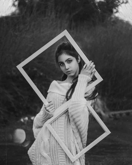 a black and white photo of a woman holding a bat, a black and white photo, inspired by irakli nadar, pexels contest winner, surrealism, square pictureframes, portrait jisoo blackpink, [ floating ]!!, with a square