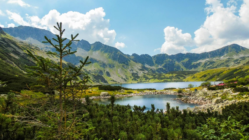 a large body of water surrounded by mountains, by Julia Pishtar, pexels contest winner, hurufiyya, poland, avatar image