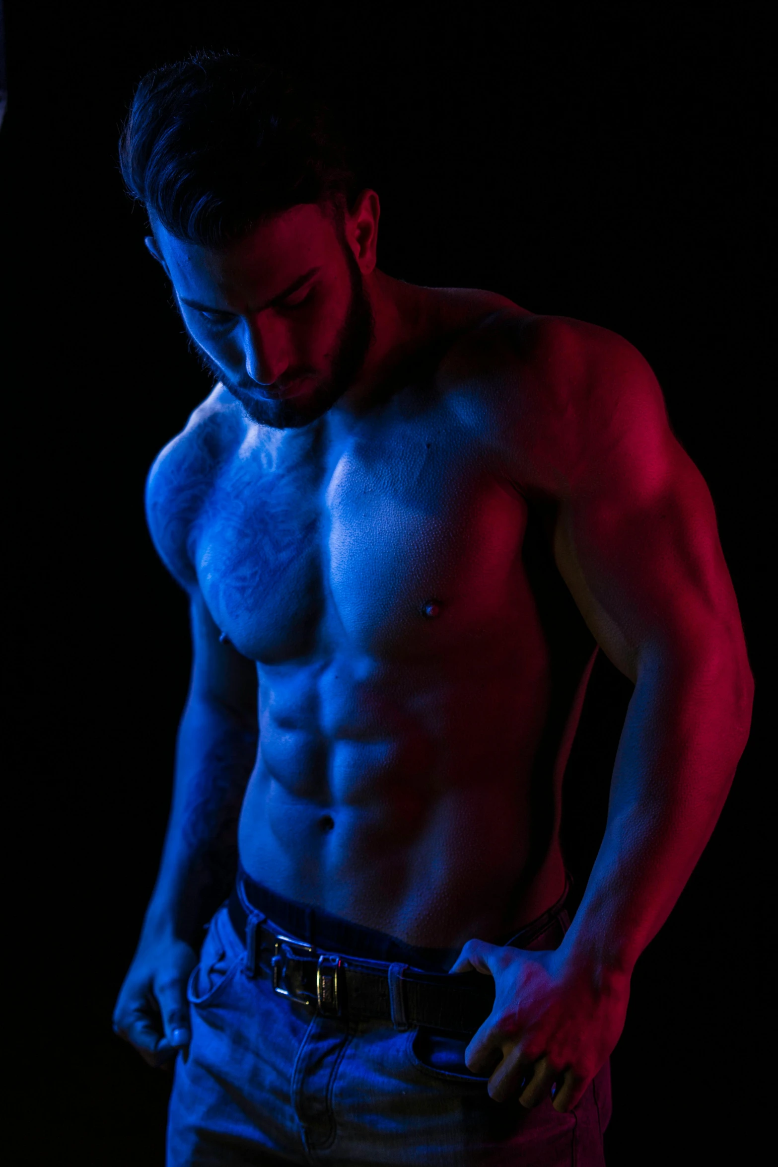 a shirtless man standing in the dark, pexels contest winner, holography, red and blue black light, fitness model, club photography, hairy bodies