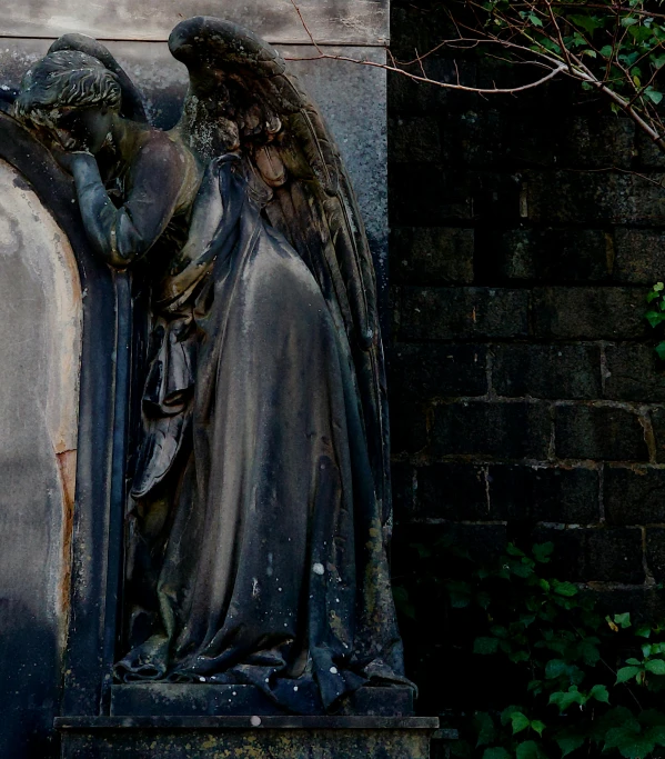 a statue of an angel on the side of a building, by Alejandro Obregón, unsplash, romanticism, abandoned overgrown graveyard, a dark, parce sepulto, hr giger ) ( ( stained glass