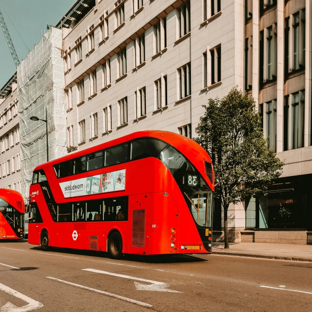 two red double decker buses parked on the side of the road, pexels contest winner, hypermodernism, zaha hadid building, 🦩🪐🐞👩🏻🦳, killian eng, bussiere rutkowski andreas rocha