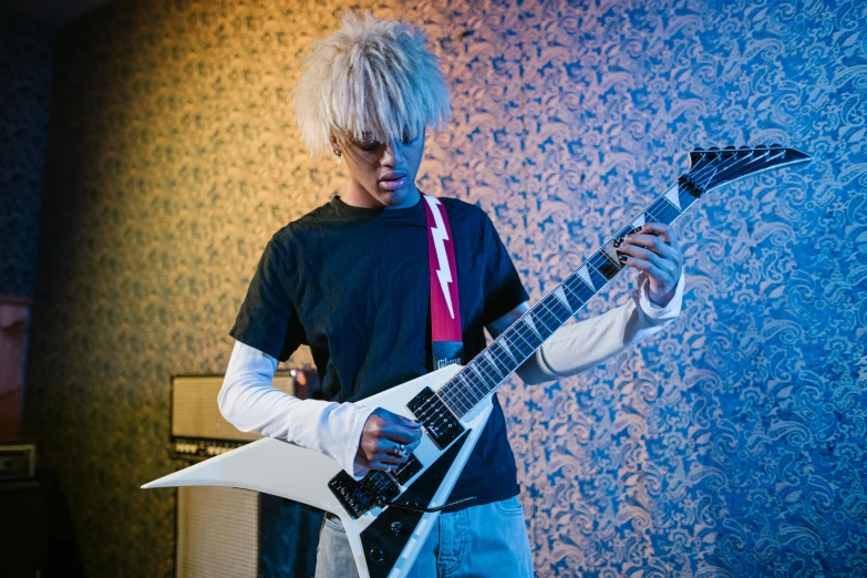 a close up of a person holding a guitar, inspired by Tadanori Yokoo, vanitas, crazy white hair, teenage boy, press photos, portrait n - 9