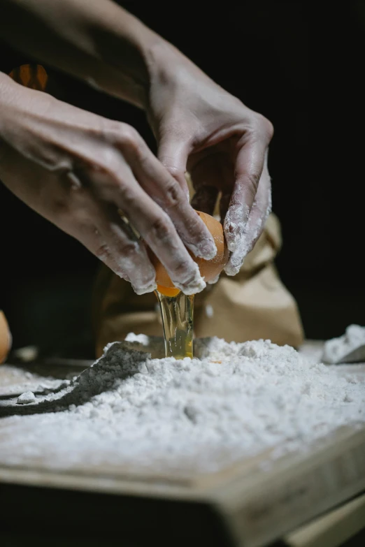 a person preparing food on a cutting board, a portrait, trending on pexels, process art, flour dust, gold, italian, pastry