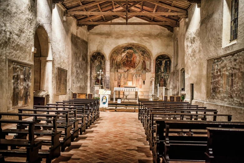 a church filled with lots of wooden pews, a portrait, by Romano Vio, romanesque, portrait image, thumbnail, valle dei templi, a cozy