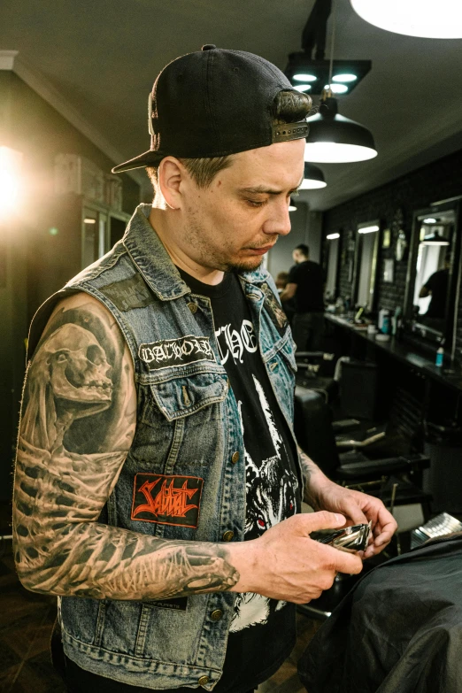 a man getting his hair cut at a barber shop, a tattoo, inspired by Seb McKinnon, metal garments, profile image, smug look, plating