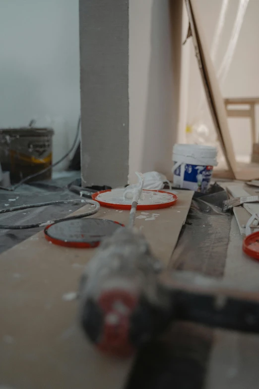 a hammer sitting on top of a piece of wood, profile image, painting of a room, marble countertops, low quality photo