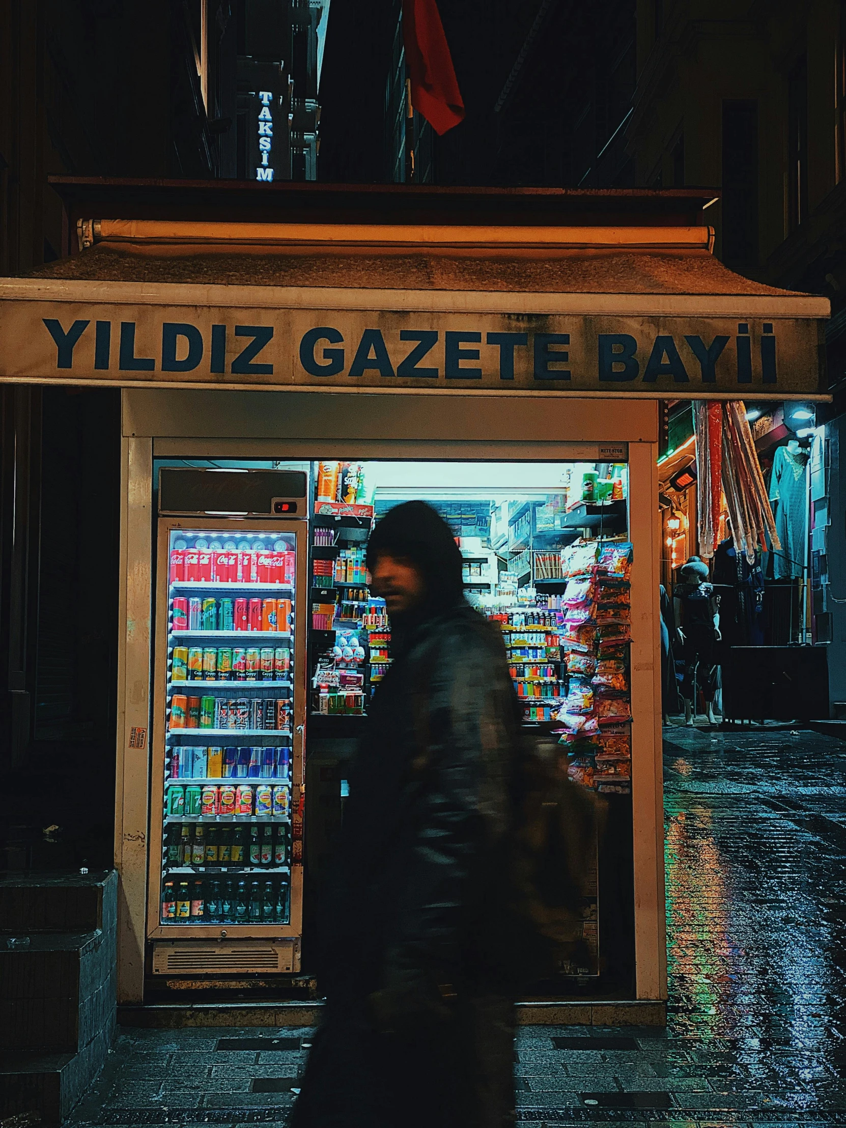 a man standing in front of a vending machine, an album cover, by irakli nadar, pexels contest winner, rainy night city street, mixture turkish and russian, shopping groceries, 🚿🗝📝