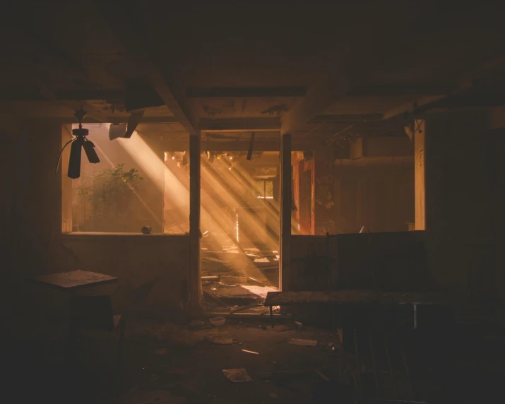 the sun shines through a window in a dark room, an album cover, inspired by Elsa Bleda, dust clouds and building debris, indoor scene, beams of light, instagram post