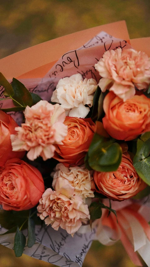 a close up of a person holding a bouquet of flowers, in shades of peach, various sizes, zoomed in, award winning