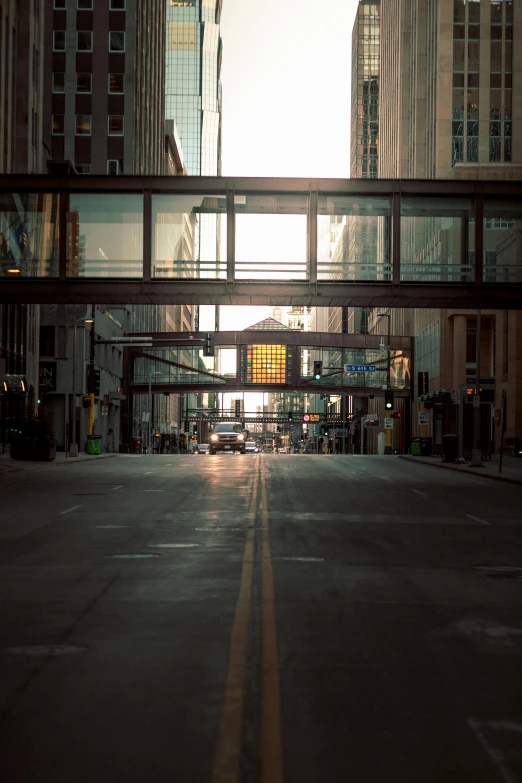 a city street filled with lots of tall buildings, a picture, unsplash, light at the end of the tunnel, iowa, glass openings, kodak promax 4 0 0