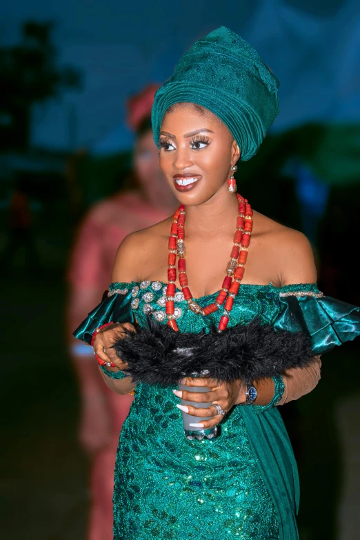 a woman in a green dress holding a fan, by Chinwe Chukwuogo-Roy, pexels contest winner, happening, jeweled headdress, wearing presidential band, nigth, intricate details. front on
