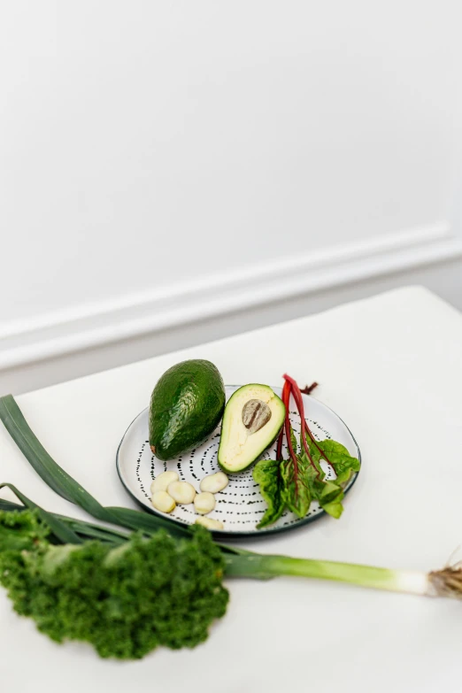 a close up of a plate of food on a table, avocado chair, organics, set against a white background, ingredients on the table