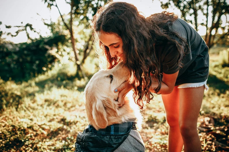 a woman standing next to a dog in a field, pexels contest winner, lovely kiss, thumbnail, teenage, australian