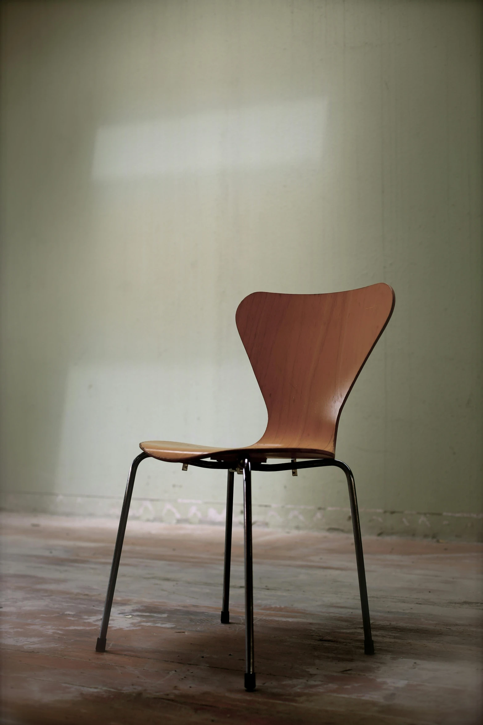 a wooden chair sitting on top of a hard wood floor, by Constantin Hansen, unsplash, postminimalism, 1960s color photograph, petite pear slim figure, high school, back - lit