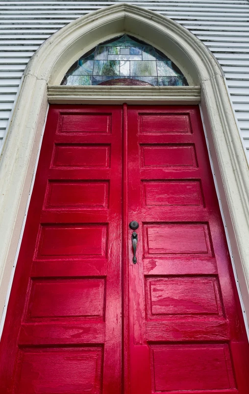 a red door in front of a white house, red fluid on walls of the church, rhode island, restoration, square