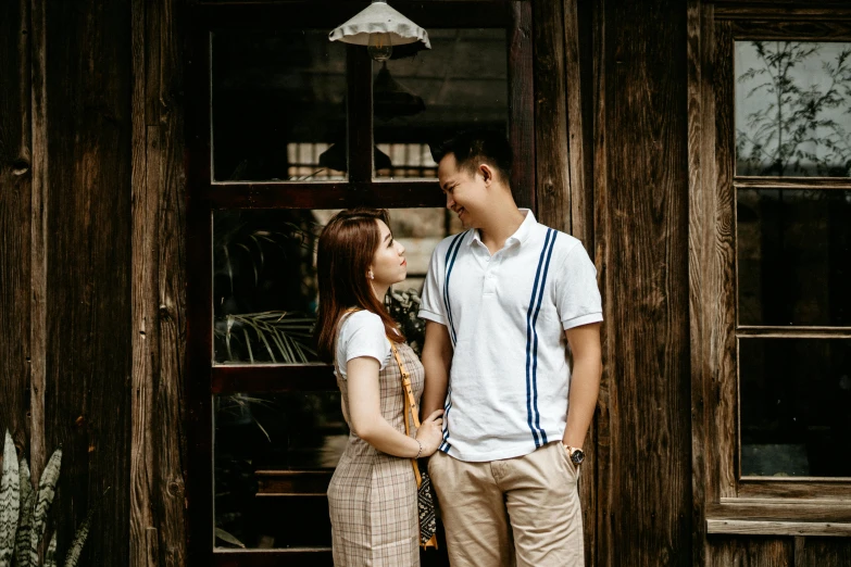 a man and a woman standing next to each other, pexels contest winner, happening, cute and lovely, avatar image, rustic, wearing polo shirt