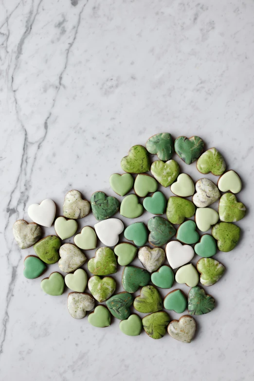 a heart made out of green and white pebbles, cookies, curated collection, dwell, 27