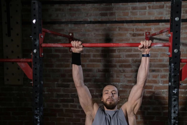 a man is doing a pull up on a bar, inspired by Jeremy Henderson, profile image, square, background image, red grid