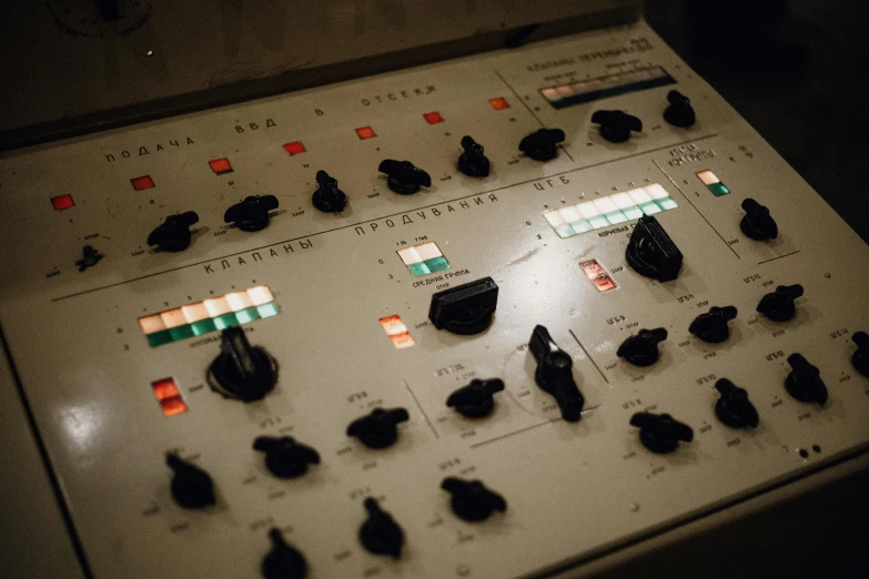 a close up of a control panel in a room, an album cover, inspired by Elsa Bleda, unsplash, bauhaus, russian lab experiment, cream, theatre equipment, studio floor
