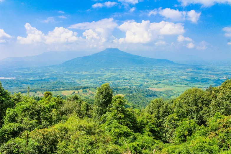 a view of a mountain from the top of a hill, pexels contest winner, sumatraism, lush forest in background, avatar image, background image, thumbnail