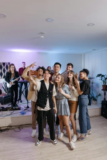 a group of people posing for a picture in a room, an album cover, unsplash, college party, pokimane, profile image, trending on tiktok
