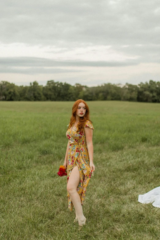 a woman standing on top of a lush green field, a portrait, unsplash, renaissance, beautiful redhead woman, full body photo, at a fashion shoot, 15081959 21121991 01012000 4k