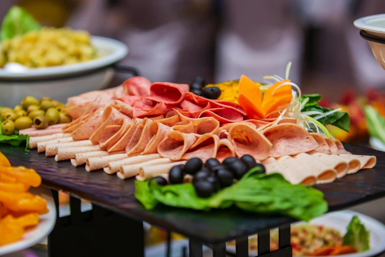 a table topped with lots of different types of food, by Niko Henrichon, pexels contest winner, salami, overflowing feast buffet table, profile image, rectangle