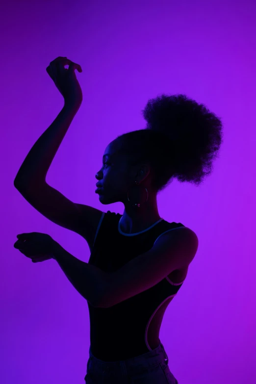 a woman standing in front of a purple background, pexels, black arts movement, modern dance aesthetic, backlight glow, getty images, black teenage girl