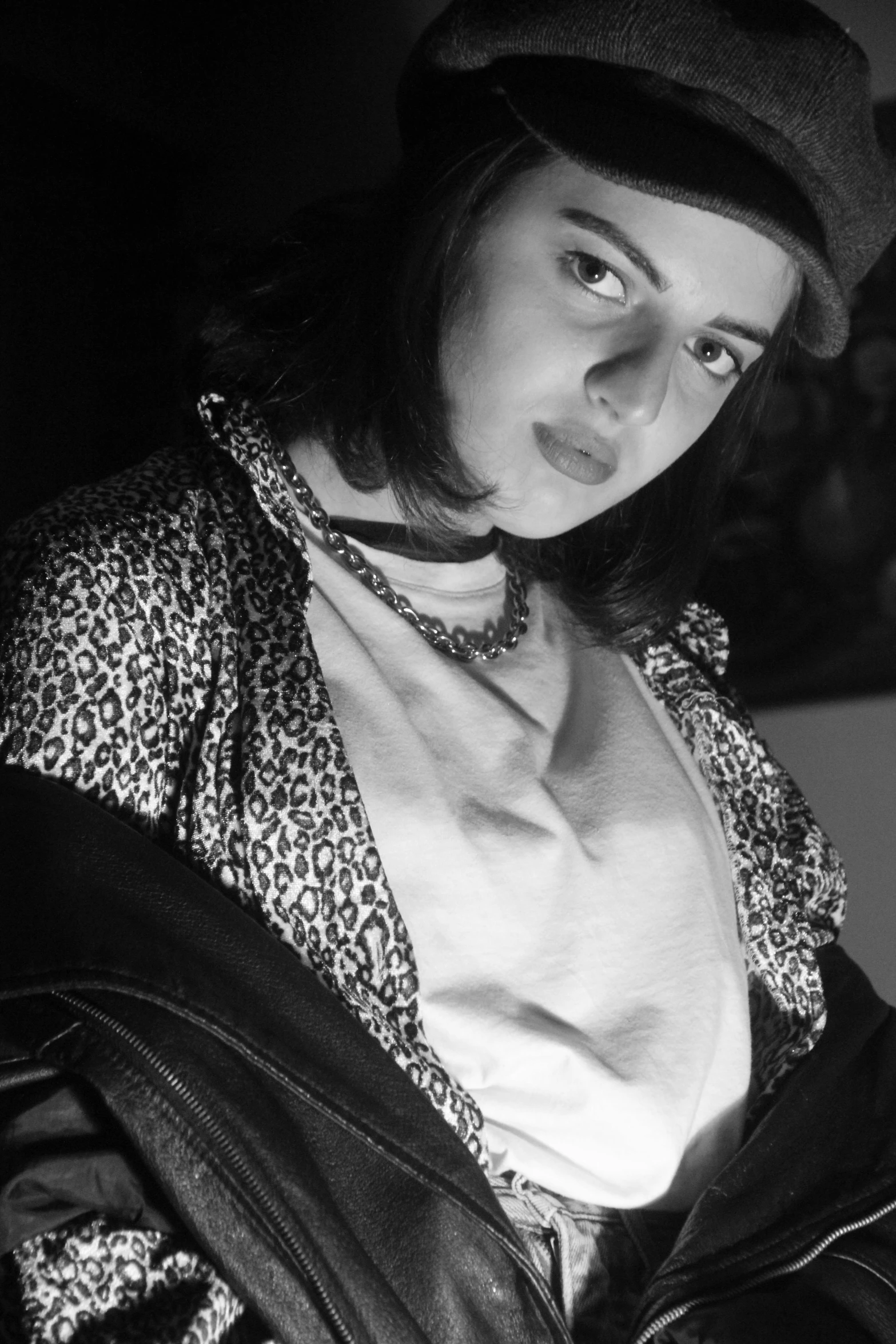 a black and white photo of a woman in a hat, a black and white photo, inspired by Ion Andreescu, photorealism, clarice starling, with shoulder pads, teenage girl, 1996)