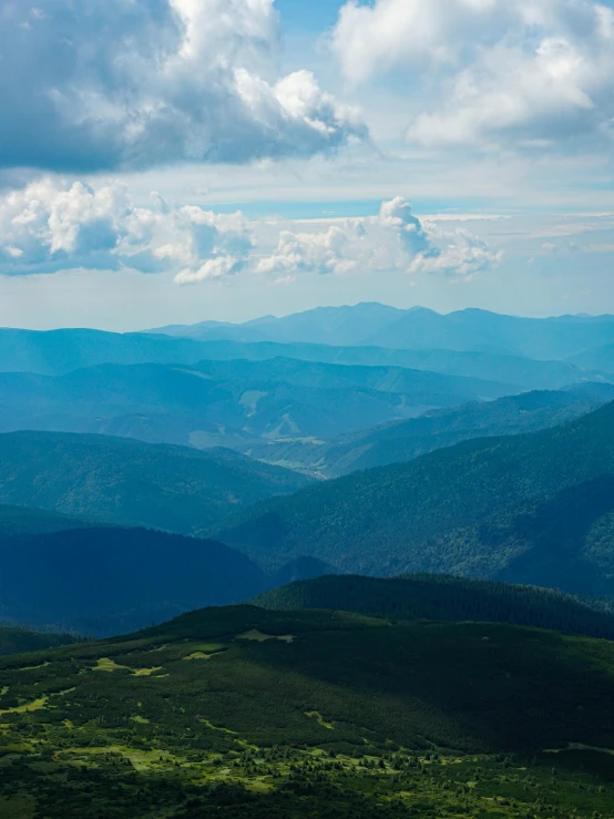 a view of the mountains from the top of a mountain, by Adam Marczyński, fan favorite, with rolling hills, thumbnail, high view