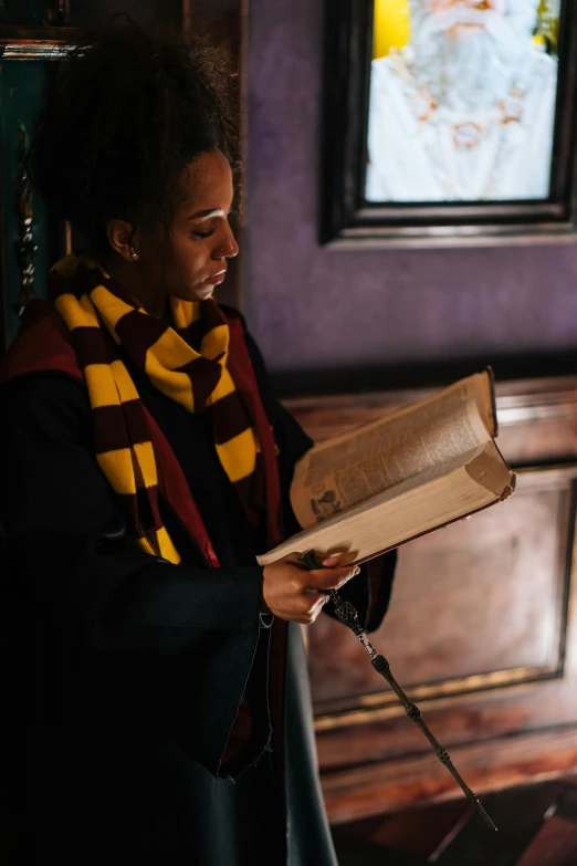 a woman reading a book in a room, a portrait, inspired by Hermione Hammond, pexels contest winner, hurufiyya, outside the'school of magic ', in a pub, academic clothing, promo image