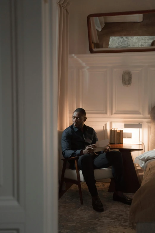 a man sitting on top of a bed next to a woman, a portrait, trending on unsplash, film still of barack obama, from netflix's arcane, standing near a window, warmly lit posh study