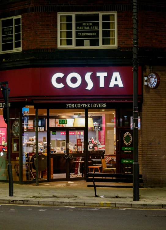 a restaurant on the corner of a street at night, award winning shopfront design, profile image, elstree, starbucks