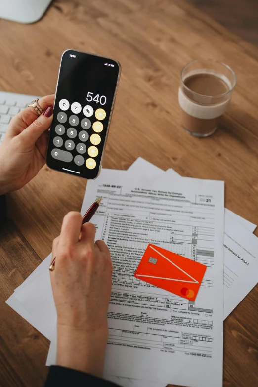 a person sitting at a table with a calculator, pexels contest winner, square, low quality photo, full-color, 2995599206