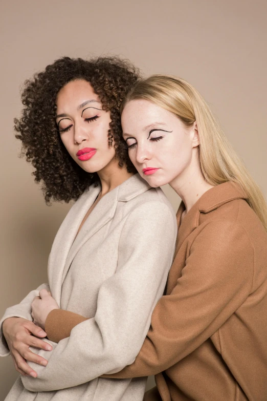 a couple of women standing next to each other, inspired by Vanessa Beecroft, trending on pexels, renaissance, sad face, lesbian embrace, with professional makeup, mixed race