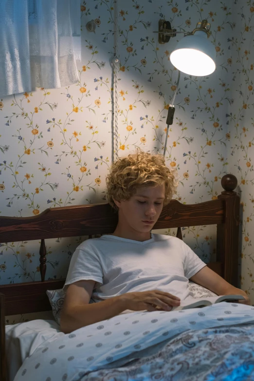 a young man laying in bed reading a book, inspired by Nan Goldin, trending on unsplash, short curly blonde haired girl, ! movie scene, ignant, mark zuckerberg as a human