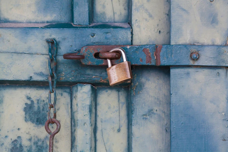 a close up of a lock on a wooden door, an album cover, inspired by William Harnett, unsplash, private press, cerulean blue and burnt sienna, iron cladding, multi - coloured, 1 7 9 5