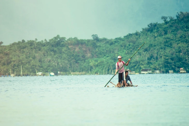 a man riding a boat on top of a lake, inspired by Fernando Amorsolo, pexels contest winner, sumatraism, 2 people, fish man, thumbnail, nostalgic 8k