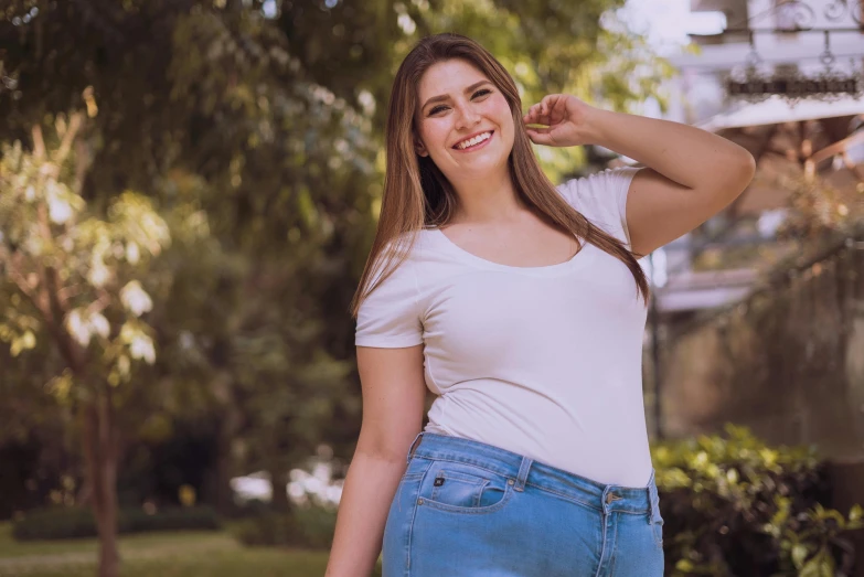 a woman in a white shirt and blue jeans, pexels contest winner, plus-sized, handsome girl, uploaded, caroline gariba