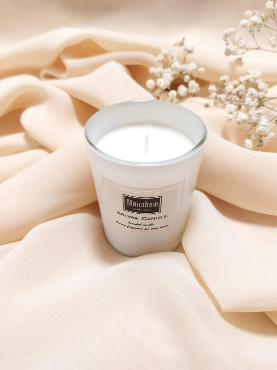 a white candle sitting on top of a white cloth, inspired by Basuki Abdullah, arabesque, official product image, moonlight grey, premium, pastel'